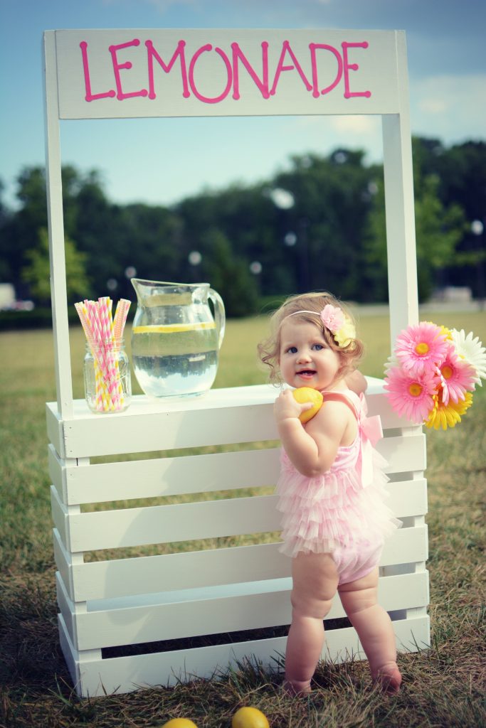 Lemonade stand photo shoot. Baby lemonade photo shoot. 9 month pictures. Lemonade stand photo shoot ideas.