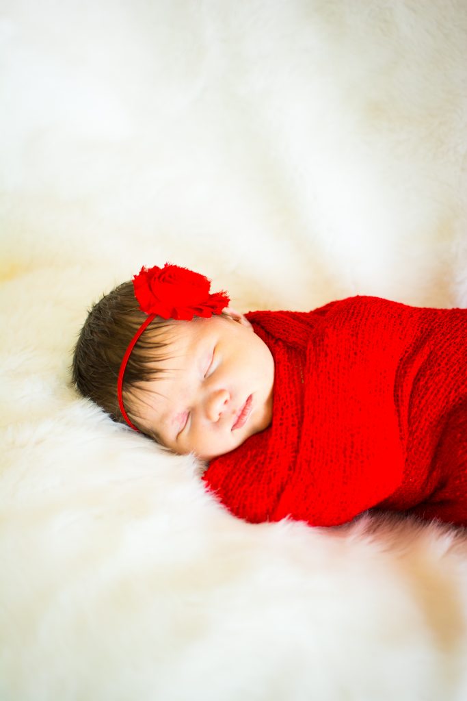 Newborn photo shoot. Newborn and family photo shoot. Baby girl newborn photo shoot. Red swaddle newborn photos