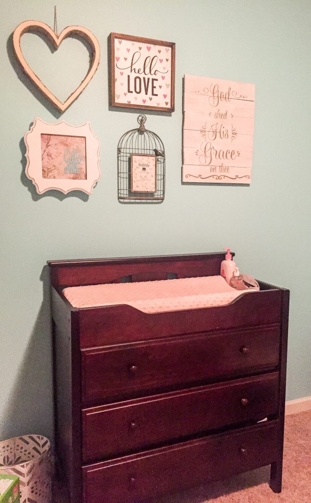 Aqua and pink nursery. Aqua and pink nursery decor with bird accents. Nursery storage solutions.