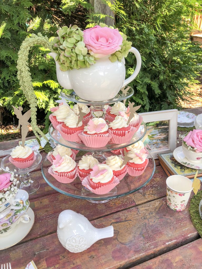 Fairy garden tea party ideas for girls. Fairy birthday party decorations. Tea party food ideas. Tinker Bell birthday party theme decoration ideas. Fairy birthday party favors. Fairy cupcakes with Tinker Bell toppers and butterfly toppers